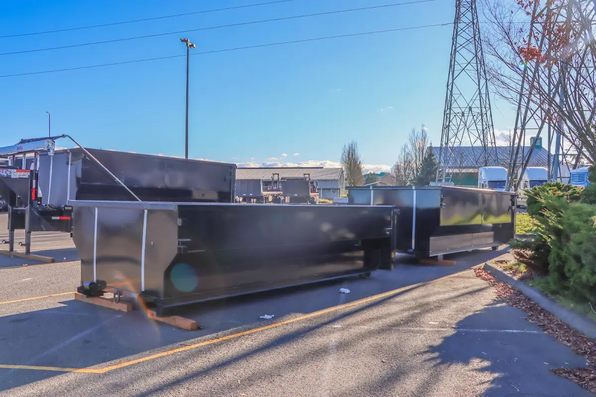 Roll-off dumpster ready for waste disposal at job site for Concrete Dumpster Rental in Cameron Park